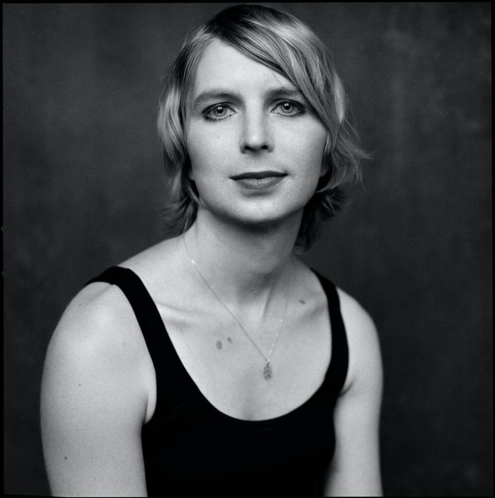 A black and white portrait of Chelsea Manning.