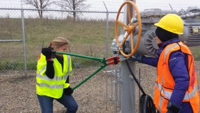 Annette and Emily turn off valve.