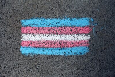 Trans Flag Photo by Katie Rainbow 🏳️🌈: https://www.pexels.com/photo/a-pride-flag-drawn-on-the-ground-8275181/
